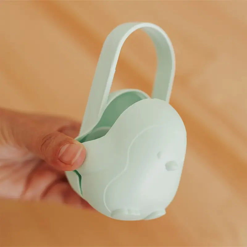 Porta-chupetas Miniland Penguin com pega Mint Penguin